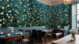 Botanical wall mural featuring delicate blooms and birds, displayed in rustic cafe with wooden tables