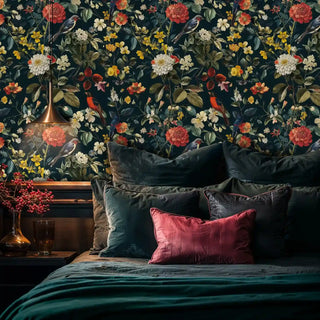 Botanical wallpaper featuring birds and blooms in rich teal, displayed in luxurious bedroom with velvet pillows