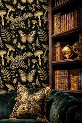 Botanical wallpaper featuring gold mushrooms and butterflies, displayed in cozy library with classic armchair