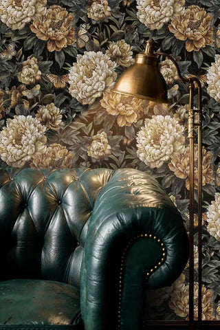 Botanical wallpaper featuring golden peonies and butterflies, shown in luxury study with brass floor lamp and green leather chair