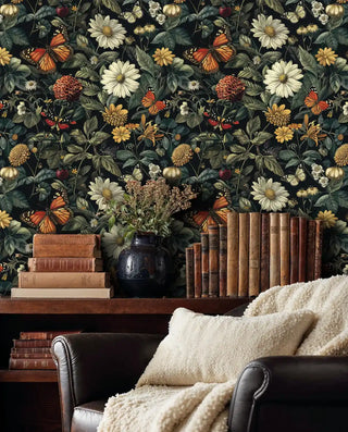 Botanical wallpaper showing butterflies and wildflowers in cozy study with vintage books and leather armchair
