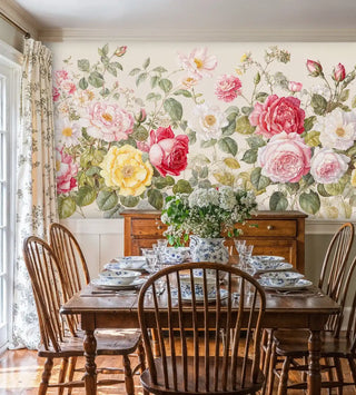 Botanical wallpaper with romantic roses in soft pastels, shown in traditional dining room with Windsor chairs