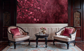 Burgundy cherry blossom wallpaper with pink flowers displayed in formal sitting room with tufted chairs