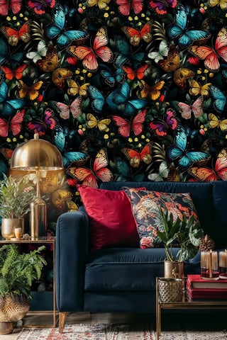 Butterfly garden wallpaper featuring colorful butterflies and wildflowers in a modern living room with navy sofa