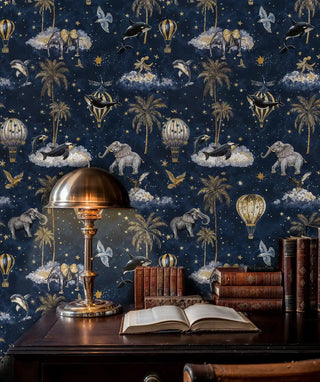 Celestial adventure wallpaper featuring hot air balloons, elephants, and stars in navy and gold, shown in study