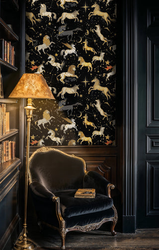 Celestial constellation wallpaper with golden mythical creatures and stars in elegant study with vintage chair