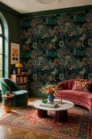 Celestial garden wallpaper with teal butterflies and gold moons in an eclectic room with rose curved sofa
