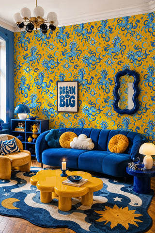 Celestial horse wallpaper with suns and crescent moons, in a living room with blue sofa and yellow cloud table