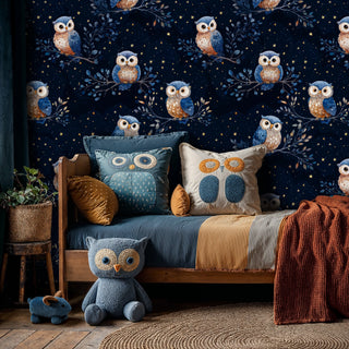 Celestial owl wallpaper featuring detailed owls on branches with golden stars, displayed in cozy kids bedroom