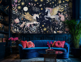 Celestial unicorn Wall Mural with botanical elements and starlit sky, in luxurious living room with blue velvet sofa