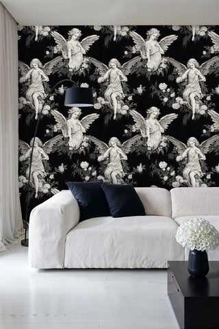 Celestial wallpaper with repeating angel motifs, shown in modern living room with beige sectional sofa