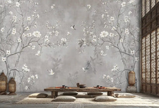 Cherry blossom wall mural with hummingbirds and white flowers on grey backdrop, shown in zen dining room with floor cushions