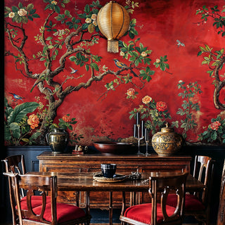 Chinoiserie bird and flower wallpaper on red background in dining room with paper lantern and wooden furniture