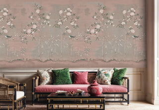 Chinoiserie floral wallpaper with perched songbirds, displayed in sophisticated living room with pink velvet sofa