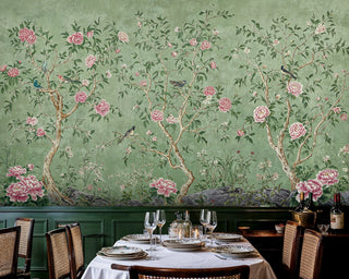 Chinoiserie peony wall mural with pink blooms and songbirds on sage green, shown in elegant dining room