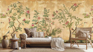 Chinoiserie wall mural depicting birds among flowering trees, displayed in natural living space with daybed