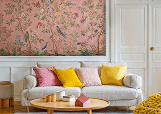 Chinoiserie Wall Mural displaying birds and blossoms, featured in modern living room with yellow accent pillows