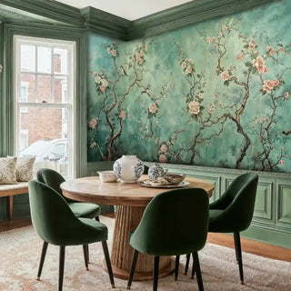 Chinoiserie Wall Mural featuring birds and flowering branches in sage green, displayed in elegant dining room with green chairs