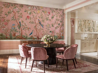 Chinoiserie Wall Mural with birds and flowers on coral background, shown in elegant dining room with round table