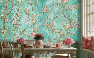 Chinoiserie wall mural with birds and pink blossoms on turquoise background in elegant dining room with ornate table