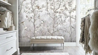 Chinoiserie wall mural with birds on branches in grey and beige, in closet with tufted bench