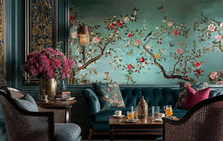 Chinoiserie wall mural with songbirds and coral peonies on sage background, shown in luxurious living room
