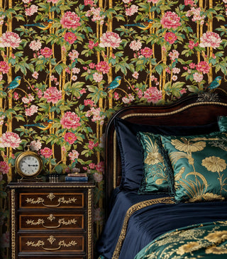 Chinoiserie wallpaper with turquoise birds and coral peonies among golden bamboo, displayed in an elegant bedroom