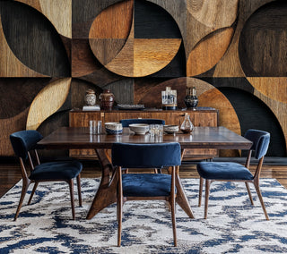 Circular wood grain pattern wallpaper, shown in sophisticated dining room with navy velvet chairs and wood table