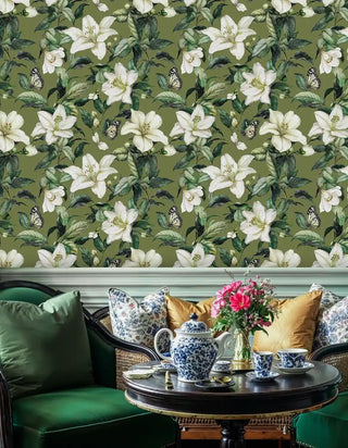 Classic botanical wallpaper featuring white lilies, shown in dining area with blue china tea set
