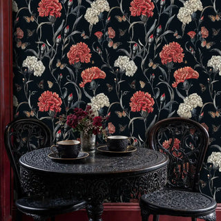Classic botanical wallpaper with coral carnations in intimate dining nook with ornate cast iron table