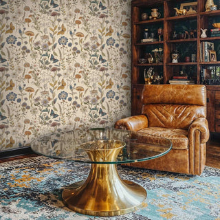 Classic botanical wallpaper with garden motifs and butterflies, shown in sophisticated study with leather chair