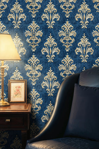 Classic damask wallpaper in navy and gold with scrollwork design, featured in elegant room with framed botanical art