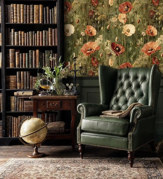Classic poppy meadow wallpaper in sage and coral, displayed in library study with leather wingback chair and globe