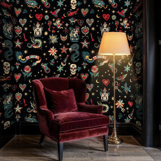 Classic tattoo wallpaper with celestial motifs and hearts, styled in elegant reading room with brass lamp