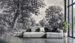 Classical countryside wallpaper showing tree-lined path and rustic gate, featured in minimalist living space with modern sofa