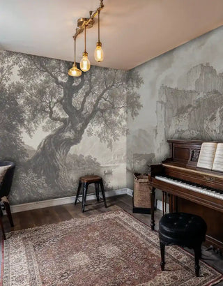 Classical engraving-style wall mural showing lake and mountains in cozy music room with upright piano