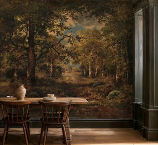 Classical forest landscape wall mural with golden trees and winding path, shown in rustic dining room with wooden table