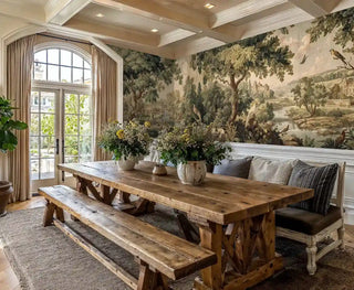 Classical landscape wall mural featuring pastoral scene, shown in elegant dining room with rustic wooden table