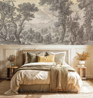Classical landscape wall mural with ancient trees and distant architecture, shown in cozy bedroom with woven headboard