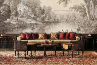 Classical pastoral wall mural in neutral tones, shown in luxurious lounge with red velvet cushions