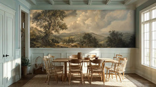 Classical pastoral wallpaper with rolling hills and cloudy sky, shown in dining room with wooden table
