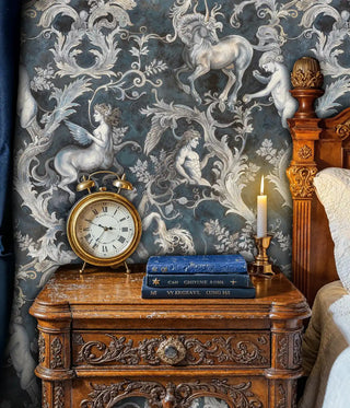 Classical wallpaper with mythological creatures and scrollwork, featured in study corner with antique clock and brass candlestick