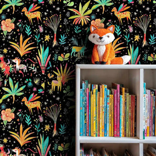 Colorful safari animal wallpaper with deer and crane motifs, displayed in reading nook with white bookshelf and fox plushie