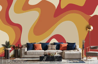 Contemporary abstract wallpaper in flowing shapes shown in modern living room with grey sectional