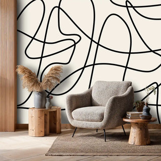 contemporary abstract wallpaper with flowing lines, in minimalist space with single armchair and pampas grass