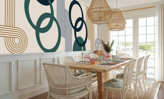 Contemporary circle pattern Wall Mural in navy and gold, styled in dining room with wicker pendant lights