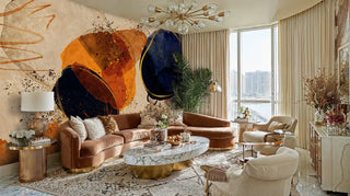 Contemporary cosmic wall mural with textured circular elements, shown in luxurious living room with velvet furniture