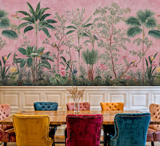 Coral tropical wallpaper with palm fronds and exotic blooms in bright breakfast nook with marble countertop