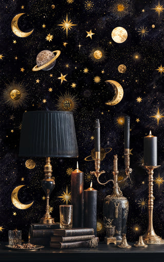 Cosmic wallpaper with moons and stars shown with vintage candlesticks and atmospheric lighting