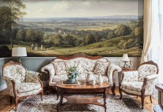 Countryside scene wall mural with rolling meadows and trees, displayed in traditional sitting room